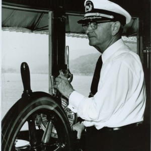 Captain Frank Brown at the helm of the Day Line's Alexander Hamilton